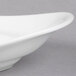 A Libbey white porcelain handle platter with curved edges on a white background.