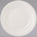 A white Tuxton china plate with a ribbed rim and embossed pattern.