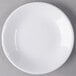 A Libbey white porcelain coupe plate with a white rim.