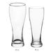 Two Acopa Pilsner glasses, one with a white rim.