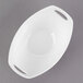 A white oval shaped bowl with handles.