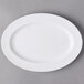 A white oval Libbey porcelain platter with a wide rim.