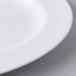 A close up of a Libbey white porcelain platter with a white rim.
