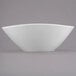 A white bowl with a small rim on a white surface