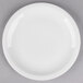 A Libbey white porcelain plate with a white rim on a gray surface.