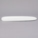 A white porcelain Libbey tray with an oval shape and long handle.