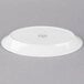A white Libbey oval porcelain platter with a circular design on it.