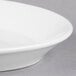 A white Libbey porcelain platter with a rim.