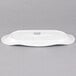 A white rectangular Libbey porcelain tray with a fluted edge and a logo.