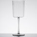A clear Fineline plastic wine glass on a stem with liquid pouring into it.
