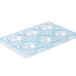 A clear plastic container with six half spheres with a blue border.