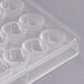 A clear plastic Matfer Bourgeat chocolate mold with 36 compartments.