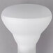 A white Satco rough service flood light bulb with a round top on a gray background.