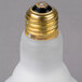 A close-up of a Satco 65 Watt Frosted Incandescent Rough Service Flood Light Bulb with a gold cap.