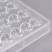 A clear plastic mold with heart-shaped compartments.