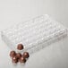 A Matfer Bourgeat plastic tray with 40 diamond-shaped chocolates.