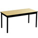 A Correll library table with a black frame and black legs and a beige top.