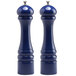 Two cobalt blue pepper mills with silver caps.