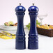 A Chef Specialties cobalt blue pepper mill and salt mill set on a table.