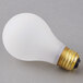 A Satco 60 watt frosted rough service incandescent light bulb with a gold base on a gray surface.