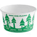 A white paper food cup with green and white tree designs and text.