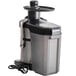 An AvaMix JE700 juice extractor with a black and silver body on a counter.