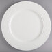 A Homer Laughlin Kensington Ameriwhite bright white china plate with a decorative border.