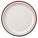 A white narrow rim china plate with brown speckles.