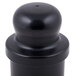 A black plastic pusher with a round top.