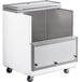An Avantco school milk cooler, a white and silver metal cabinet with a sliding door on wheels.