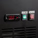 A close up of a black Avantco UDD-72-HC Beer Dispenser panel with digital temperature control and a clock with red numbers.