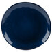 A close-up of a blue GET Cosmo melamine plate with a white irregular rim.