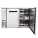 An Avantco stainless steel back bar refrigerator with beer bottles.