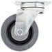 A Garland and US Range swivel plate caster with a metal wheel and black rubber tread.