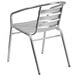 A silver aluminum Flash Furniture outdoor restaurant chair with a triple slat back.