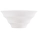 A close-up of a CAC bone white porcelain bowl with a curved edge.