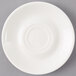A white Arcoroc porcelain saucer with a small rim.