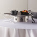 American Metalcraft large chafer wind guard on a table with food and utensils.