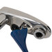 A close-up of a blue and silver T&S Deck Mounted Push Back Glass Filler Faucet.