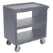 A grey plastic utility cart with wheels.