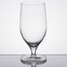 A close-up of a Reserve by Libbey Neo wine glass on a reflective surface.