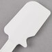 A white Rubbermaid silicone spatula.
