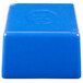 A blue plastic cube with a circle on top.