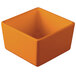 An orange square Tablecraft bowl with a lid.