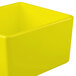 A Tablecraft yellow square bowl with straight sides.