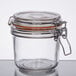 A Tablecraft glass condiment jar with a metal lid and handle.