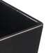 A black rectangular Tablecraft bowl with a white speckled border.