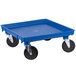 A blue plastic dolly with black wheels.