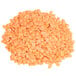 A pile of dried red lentils.