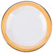 A close up of a Kanello white melamine plate with a wide white rim and a narrow yellow rim.